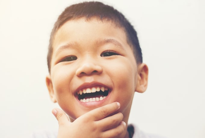 child smiling brightly