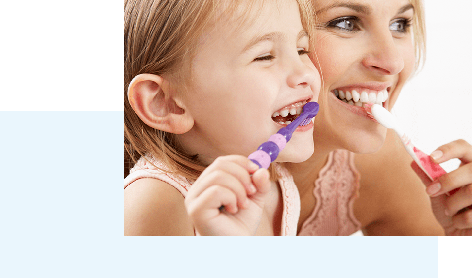 mother and daughter brushing teeth